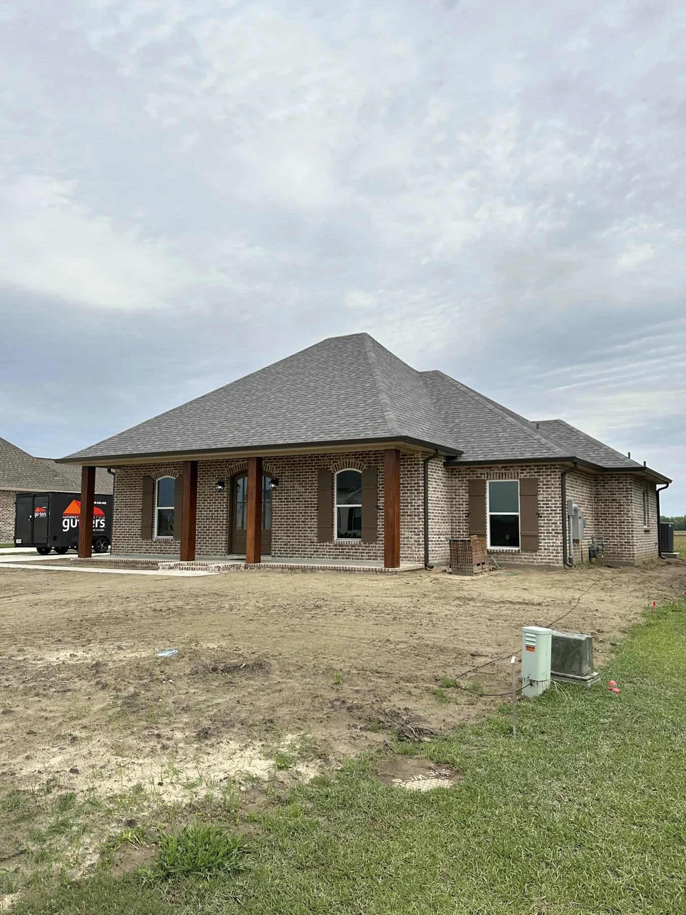 Gutter installation on a single-story brick property