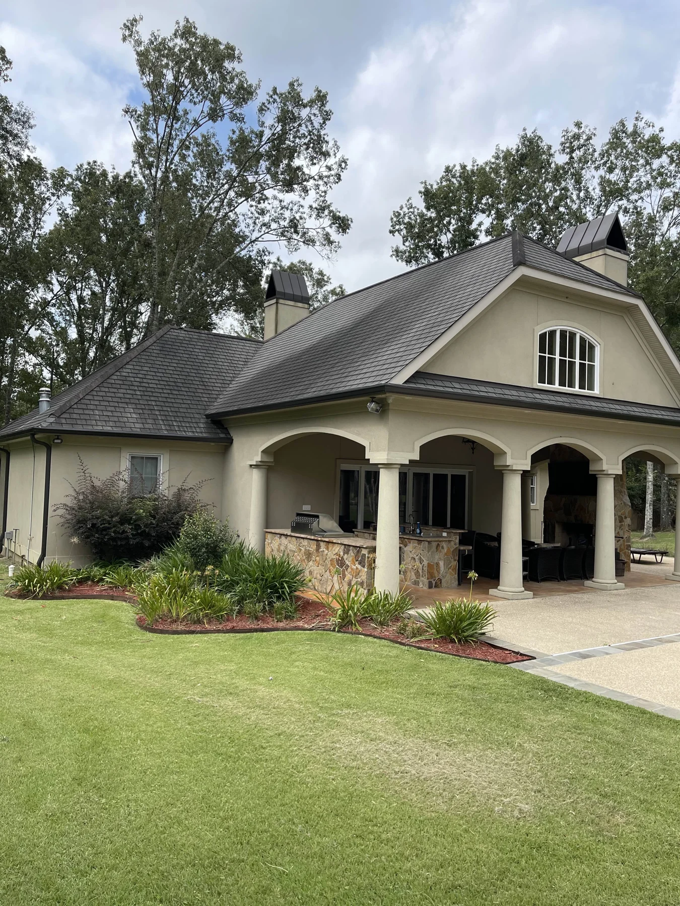 Completed gutter project at a landscaped home