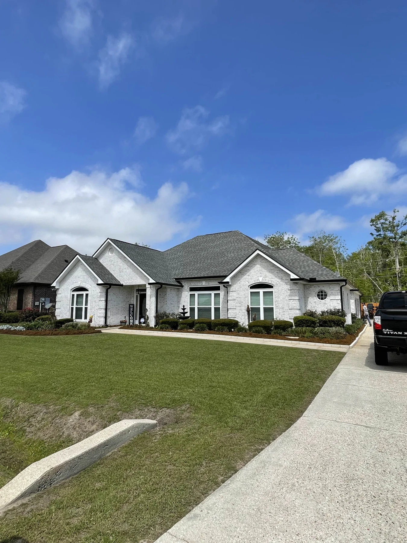 Completed residential project with light-colored gutters