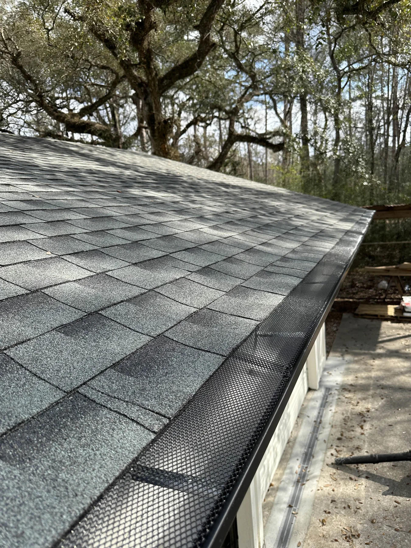 Gutter protection beneath a shaded roofline