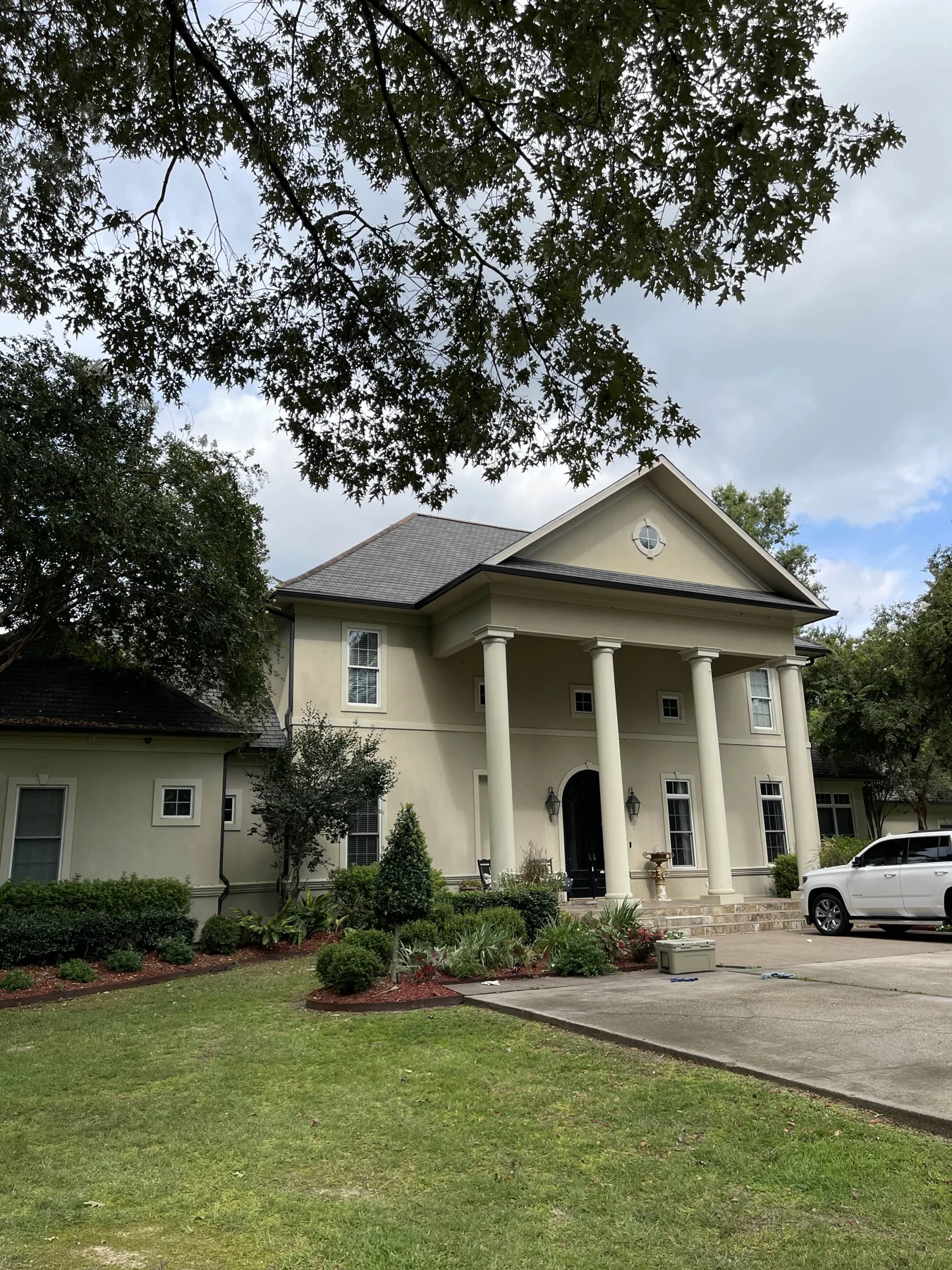 Gutters on a two-story home with columns